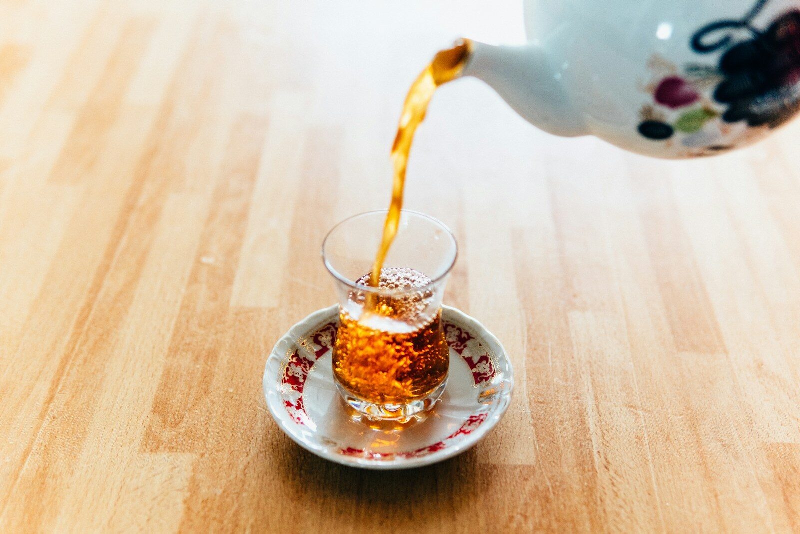 online-university-24 person pouring tea into cup
