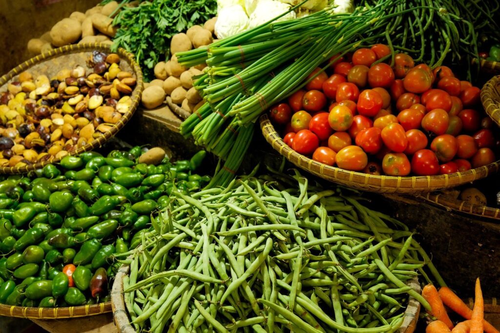 Photo by Muhamad Guruh Budi Hartono Colorful assortment of fresh vegetables in a local market setting.